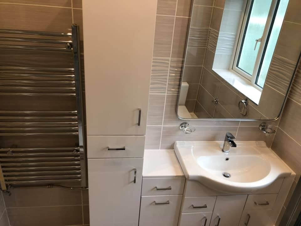 Bathroom cupboards with a sink and mirror